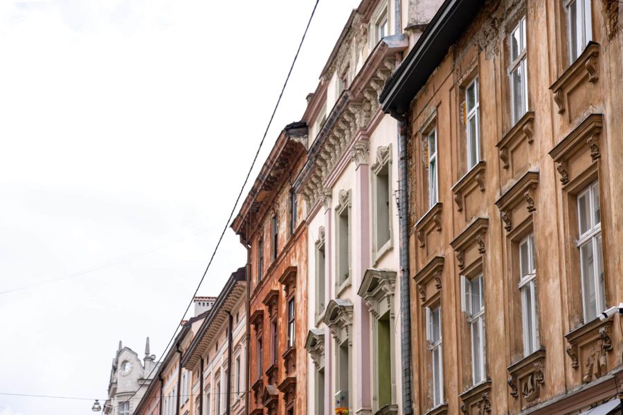 Facades of old houses in a row against the sky, old architecture, copy space.
